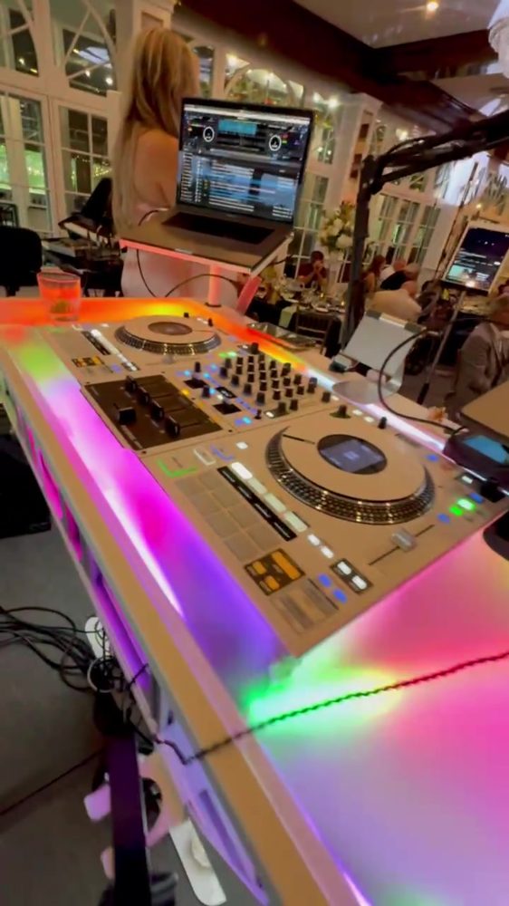 Close view of the glowing acrylic booth top with the controller and laptop